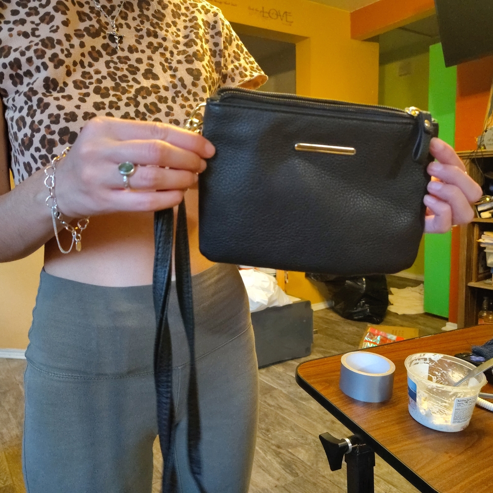 Timeless Black Crossbody Bag with Metallic Accents